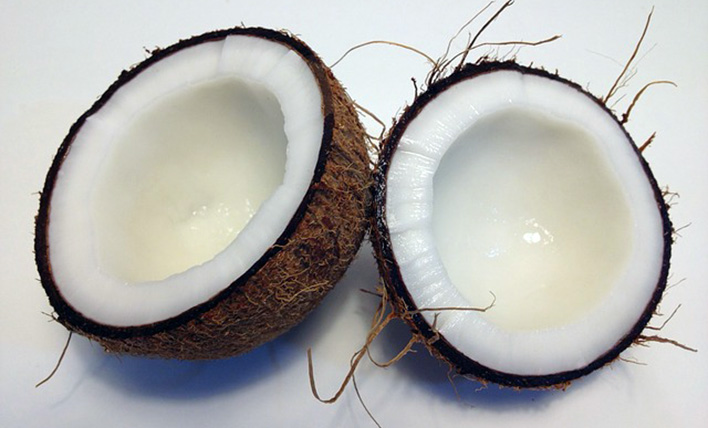 Two halves of an open coconut